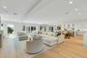 Open-concept living space featuring light wood-finish flooring, recessed lighting