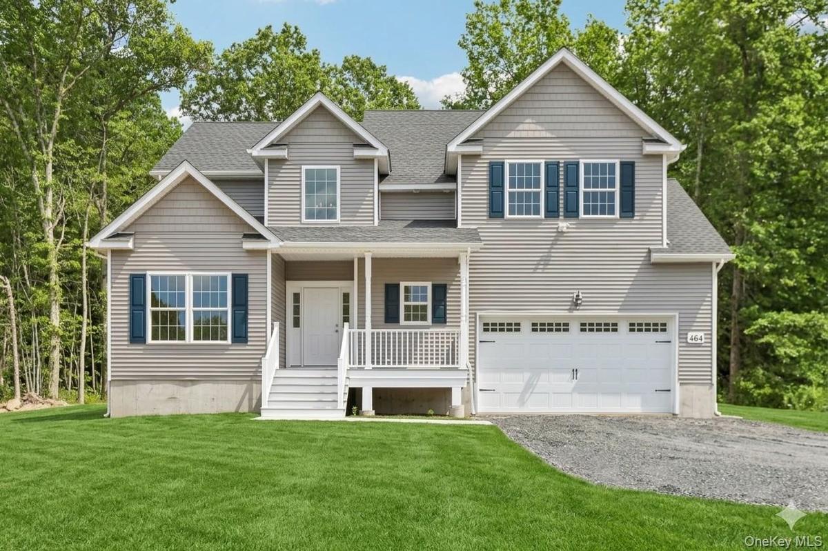 Beautiful colonial home.  Lawn is an AI-generated rendering.