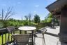 Expansive multi-level deck featuring composite decking and dark wood railings