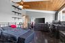 Vaulted wood-plank ceiling with a ceiling fan