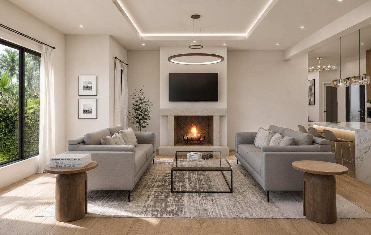 Grand family room with gas fireplace insert and custom accents throughout