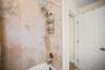 Second bathroom shower and tub combo.
