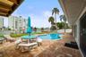 Pool with patio seating and lounge area from the covered patio.