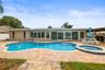 Directly facing the pool and the back of the house.