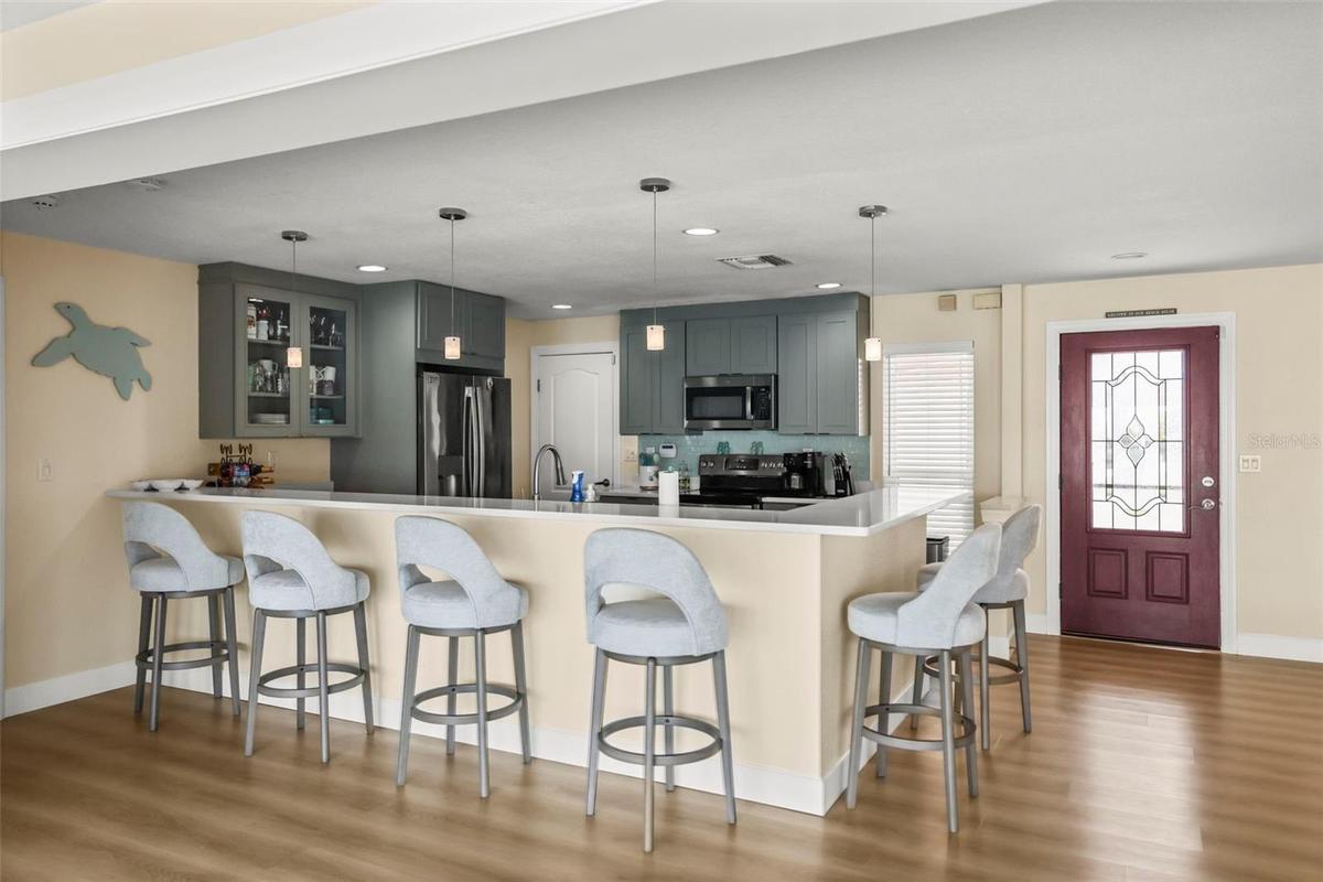 Kitchen breakfast bar facing toward the kitchen.