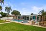 Backyard facing the pool and patio.