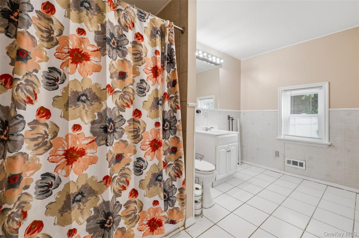 Convenience is having a first floor bathroom with a tub off of the Living room