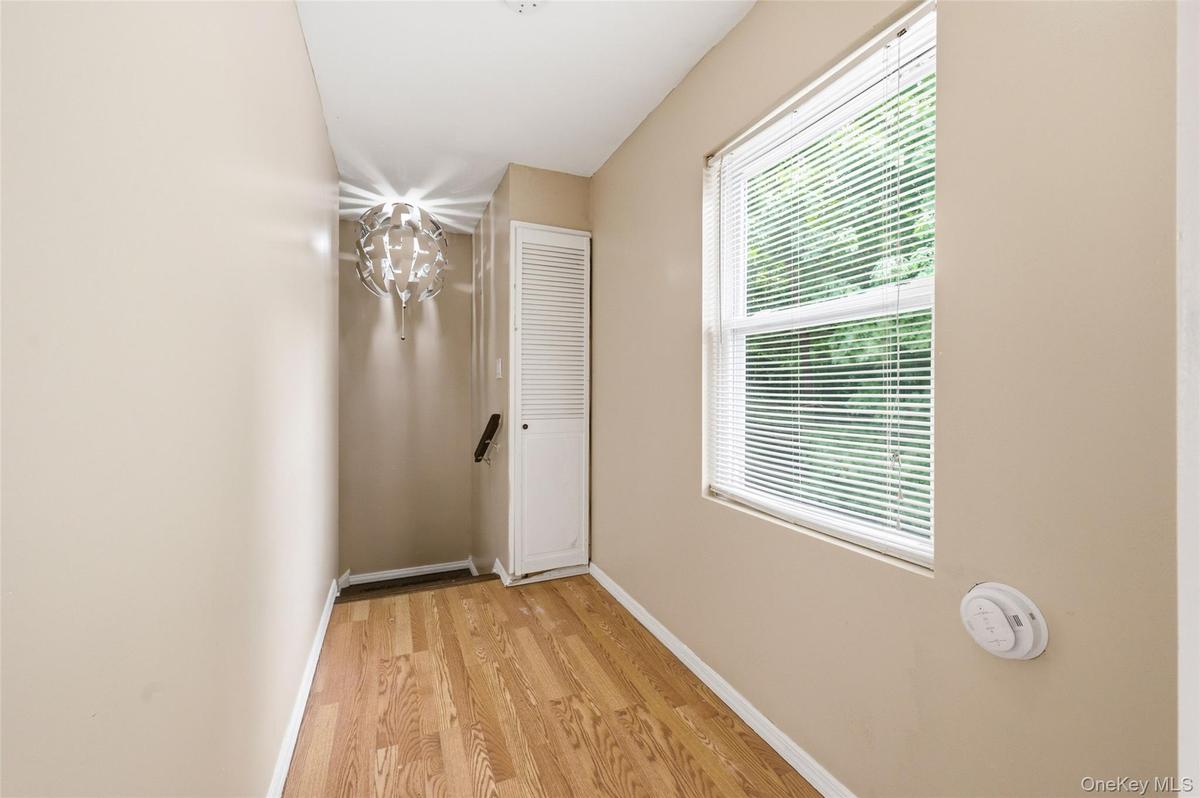 Freshly Painted Hallway on 2nd floor with window over looking the private backyard