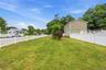 Front yard with a white picket fence.  Corner Property.  Call to view this home