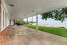 Rear stone covered patio overlooking the Sound.