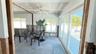 Sliding doors that lead to the wooden deck and seawall.
