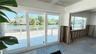 View from the living room through the sliding doors and bedroom window