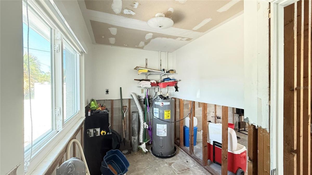 Laundry/storage room located in the front of the unit.