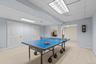 The finished lower level includes a game room with convenient storage and room for everyone to enjoy.