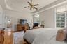 The first-floor primary suite blends comfort, sophistication, and accessibility.