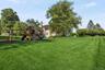 A generous level lawn with a dedicated play area enhances the property’s exceptional outdoor appeal.