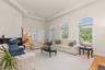 Sophisticated living room featuring timeless style and abundant natural light.