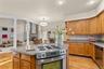 A warm and welcoming kitchen with hardwood floors, open to the family room for effortless entertaining.