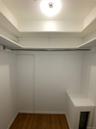 Walk-in closet, one of 2 closets in the primary bedroom