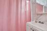 White vanity with an integrated sink and chrome faucet