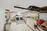 Laundry room featuring washing machine and clothes dryer and electric panel