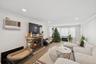 Living area featuring a fireplace, ornamental molding, wood finished floors, a wall mounted air conditioner, and recessed lighting