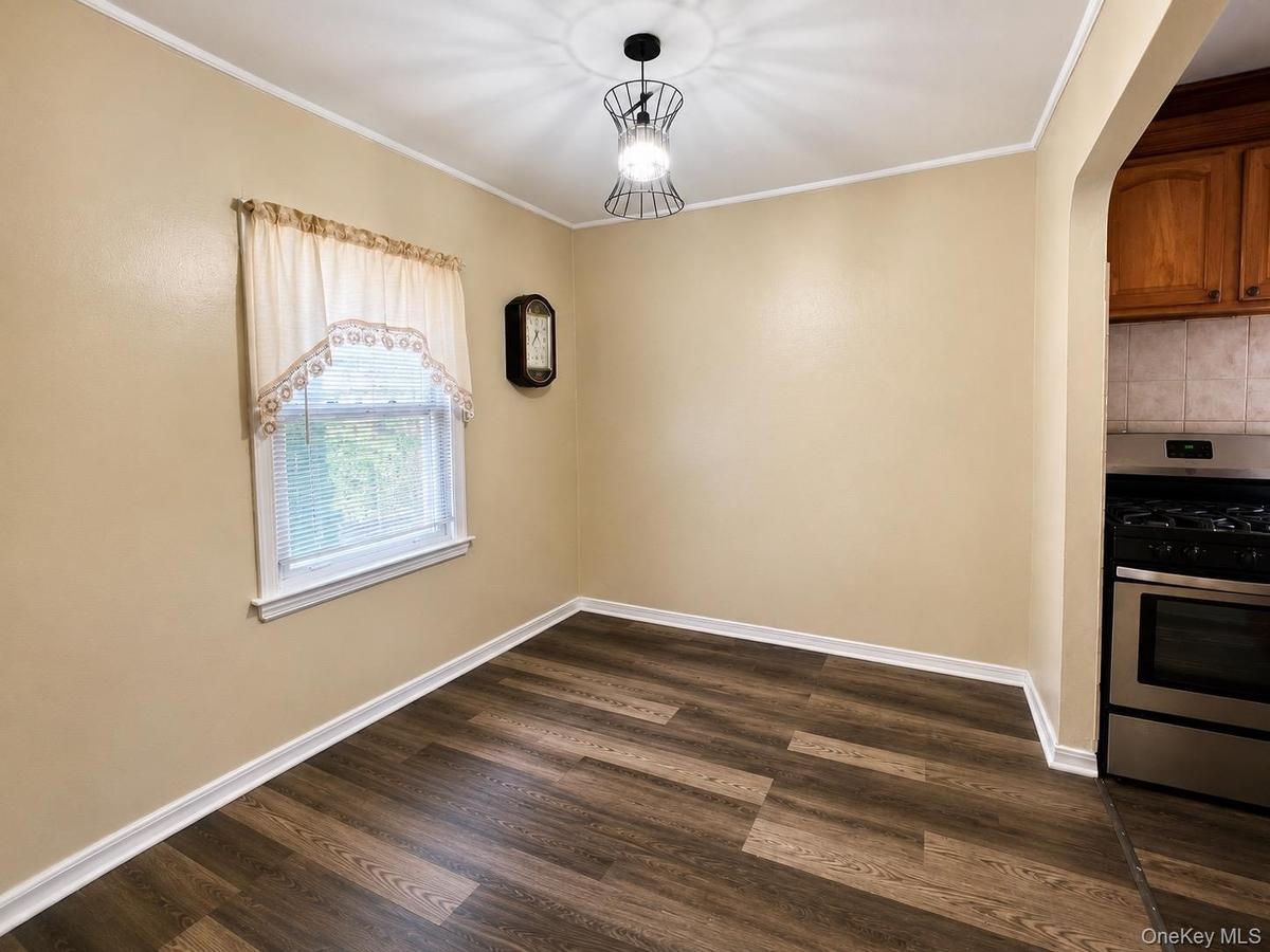 Virtually enhanced photo. Personal property and clutter have been digitally removed. Room dimensions and permanent features remain unchanged.