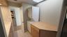 Shared guest bathroom also serves as a laundry room.