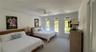 Bay-side bedroom has 2 queen beds.