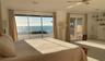 Primary suite's view and slider to outside shower.