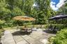 Sit on the beautiful patio and enjoy the view of the spacious backyard