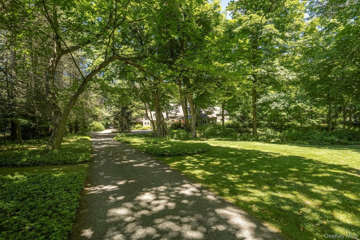 Set back from the road with a long private driveway, yet very conveniently located & accessible to everything