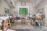 A wonderful art studio with very high ceiling has a private patio and glass sliding doors, offering great light