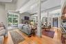 The open floor plan encompasses the great room/family room, kitchen and dining area