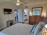 Primary bedroom with TV.