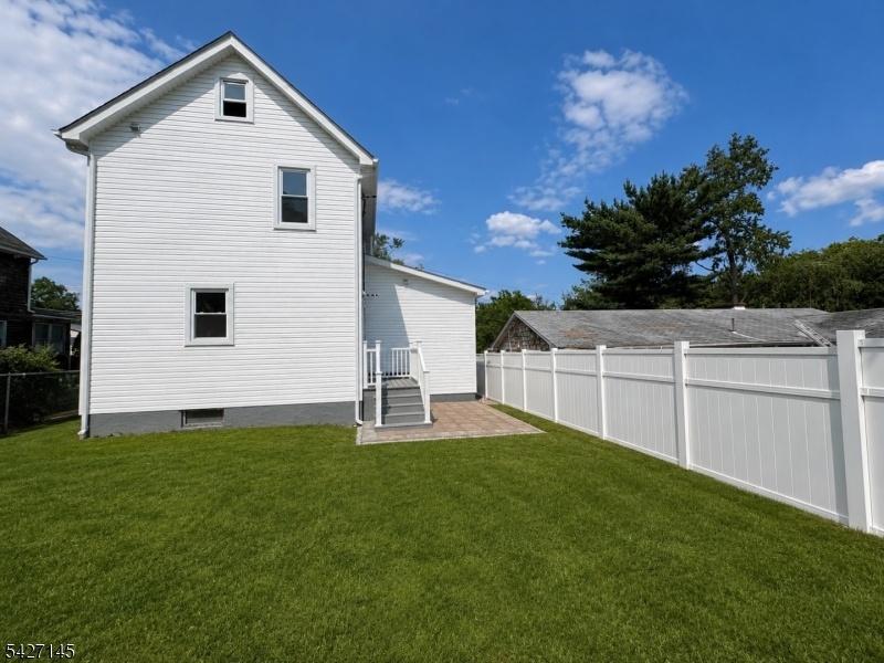 Back of house showing patio
