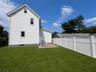 Back of house showing patio