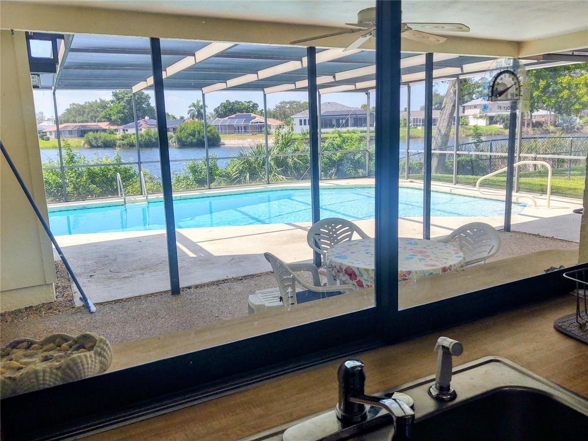 Kitchen Window View Of Pool And Lake