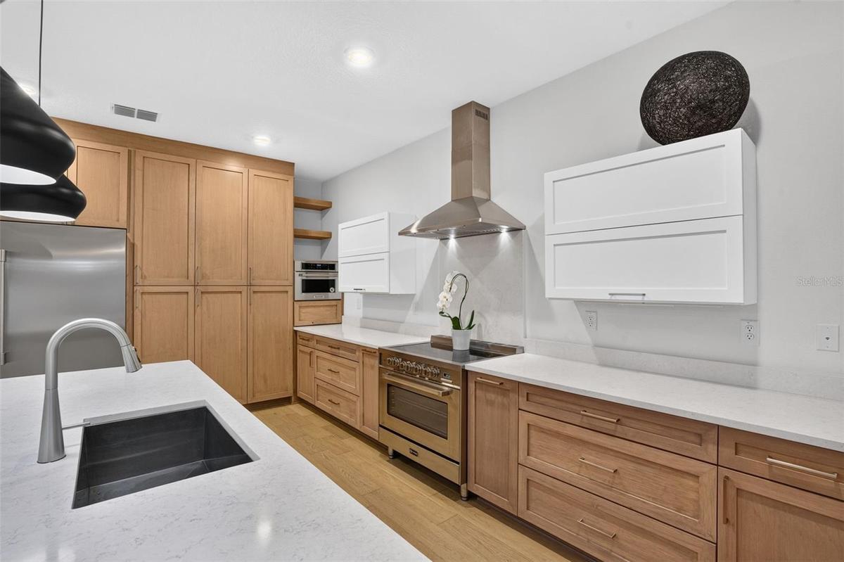 Solid wood cabinetry-stainless steal appliances