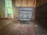 A large wood stove helps with heating the home