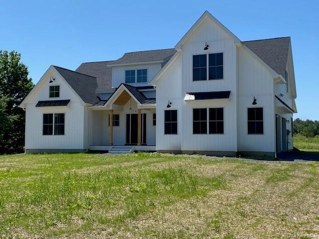 Designed for year-round enjoyment, the covered porch provides shelter, comfort, and charming curb appeal.