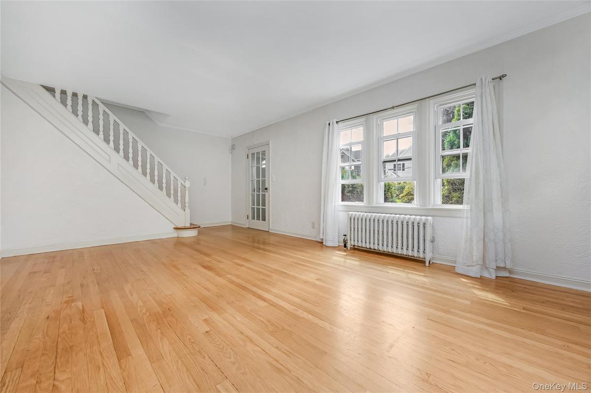 Entrance and living room with steps leading upstairs
