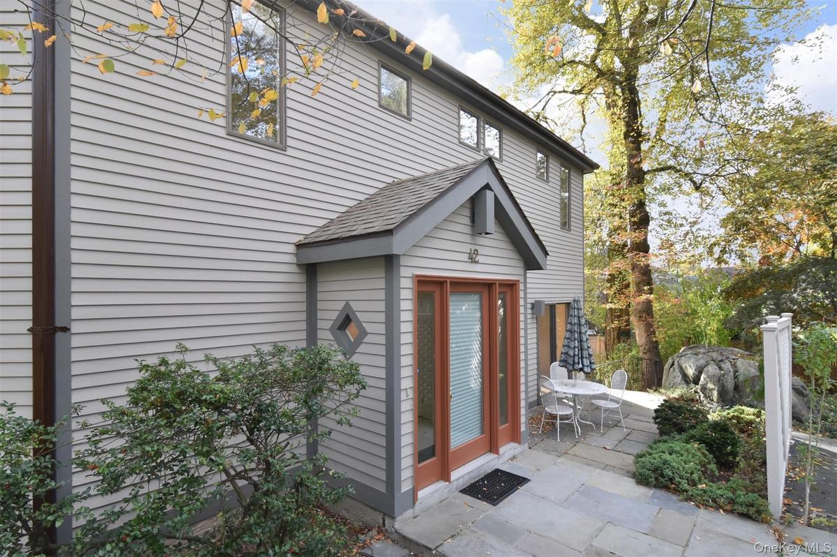 Entrance to property featuring a patio