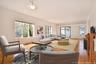 Virtually staged 30' Great Room featuring windows facing 3 directions