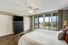 Primary Bedroom With Sliders To Outdoor Balcony