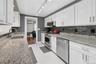 Updated Galley kitchen with view to adjacent family room