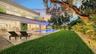 Private backyard with pool and lush landscaping