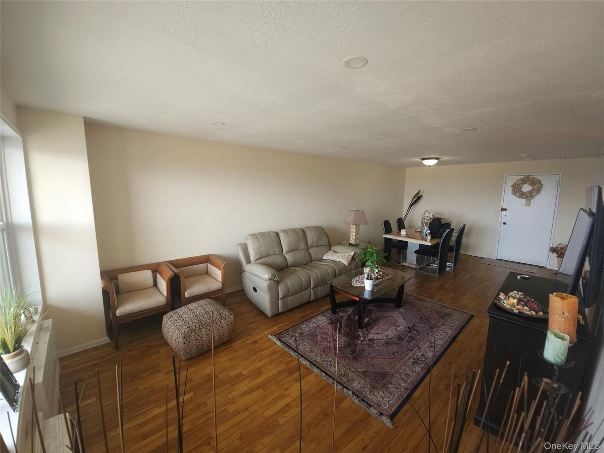 Hardwood flooring throughout, recessed ceiling lighting, and a window with natural light
