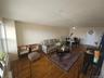 Hardwood flooring throughout, recessed ceiling lighting, and a window with natural light