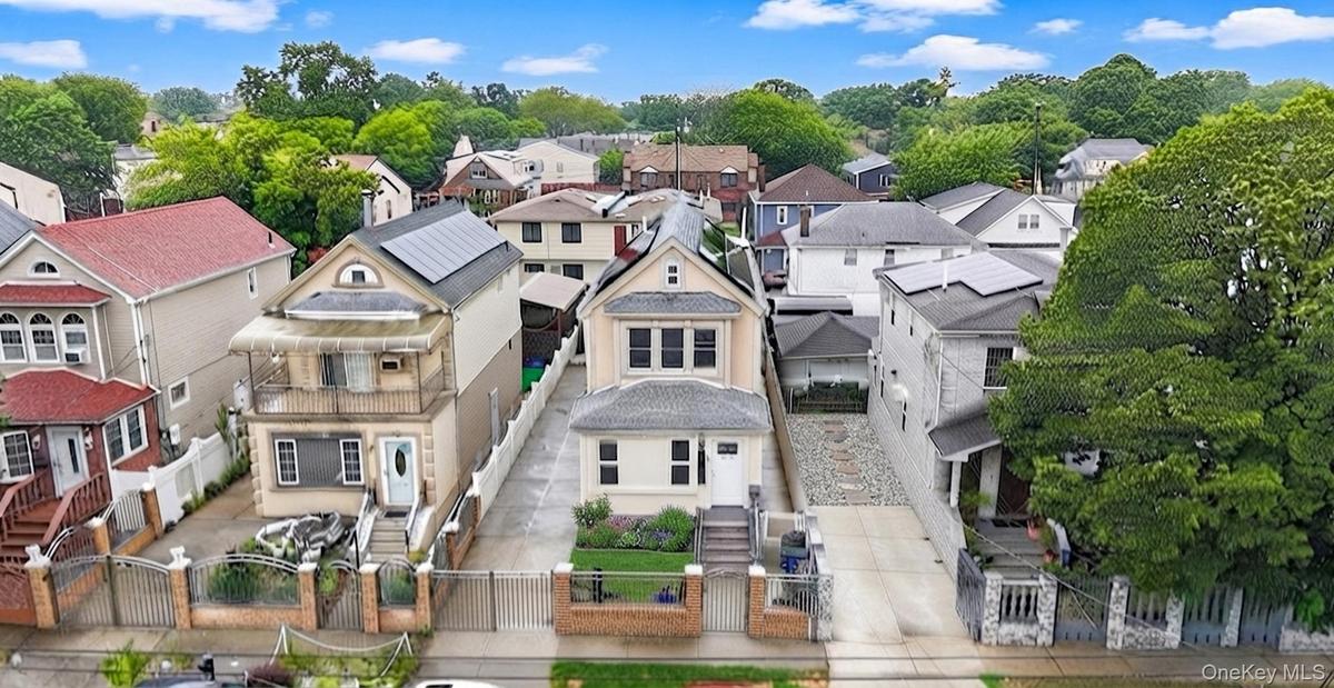 two-story residence featuring   solar panels
